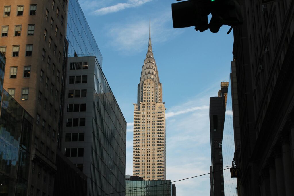 Iconic view of the Chrysler Building against a clear blue sky in New York City.